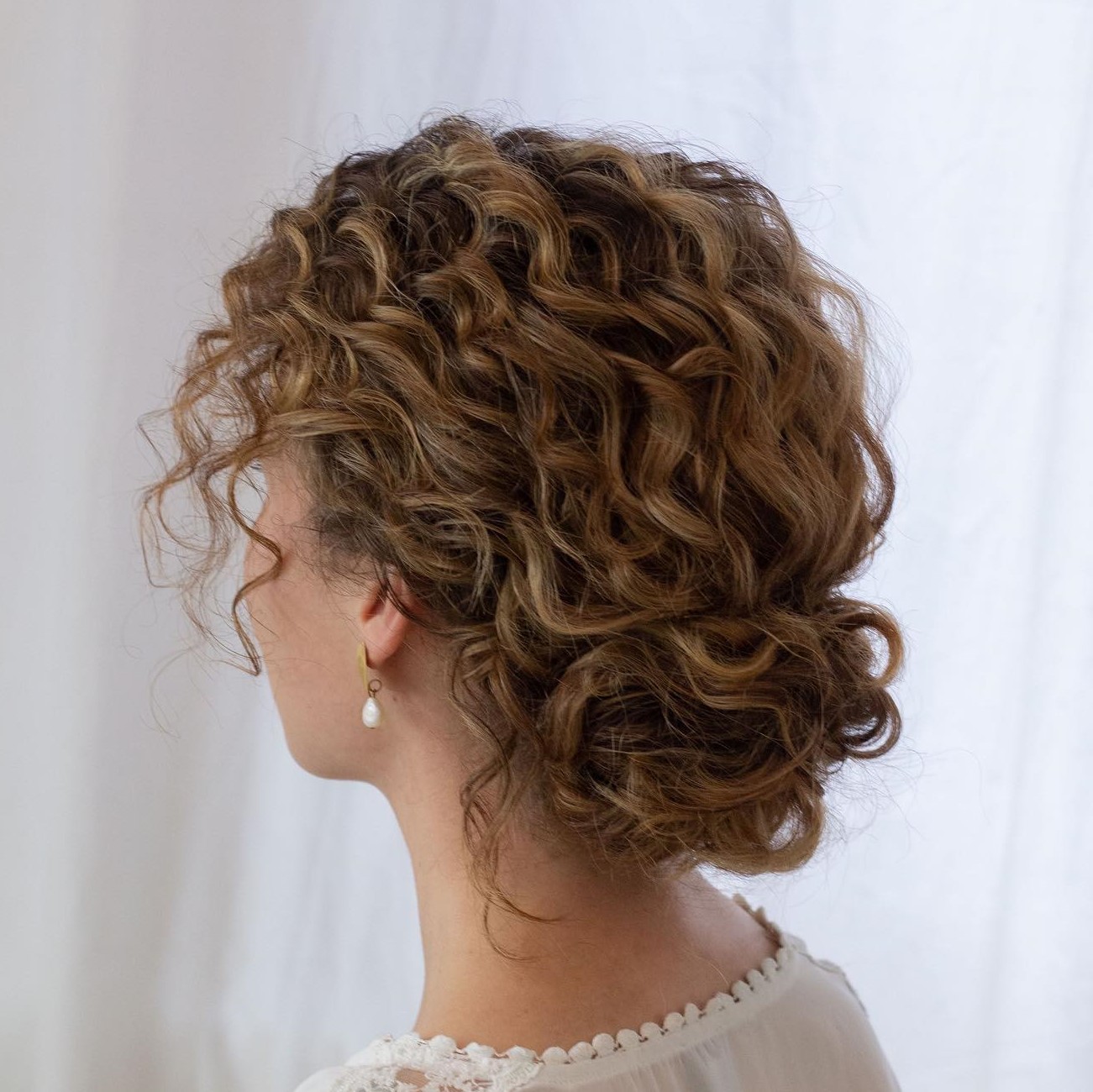 Romantic Low Bun for Short Curly Hair