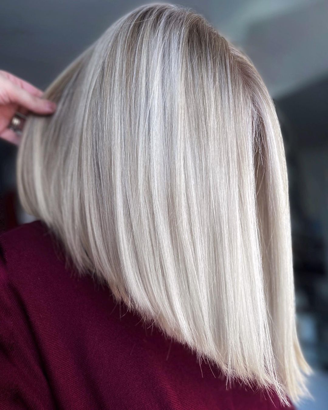 Steeply Angled White Bob for Thick Hair