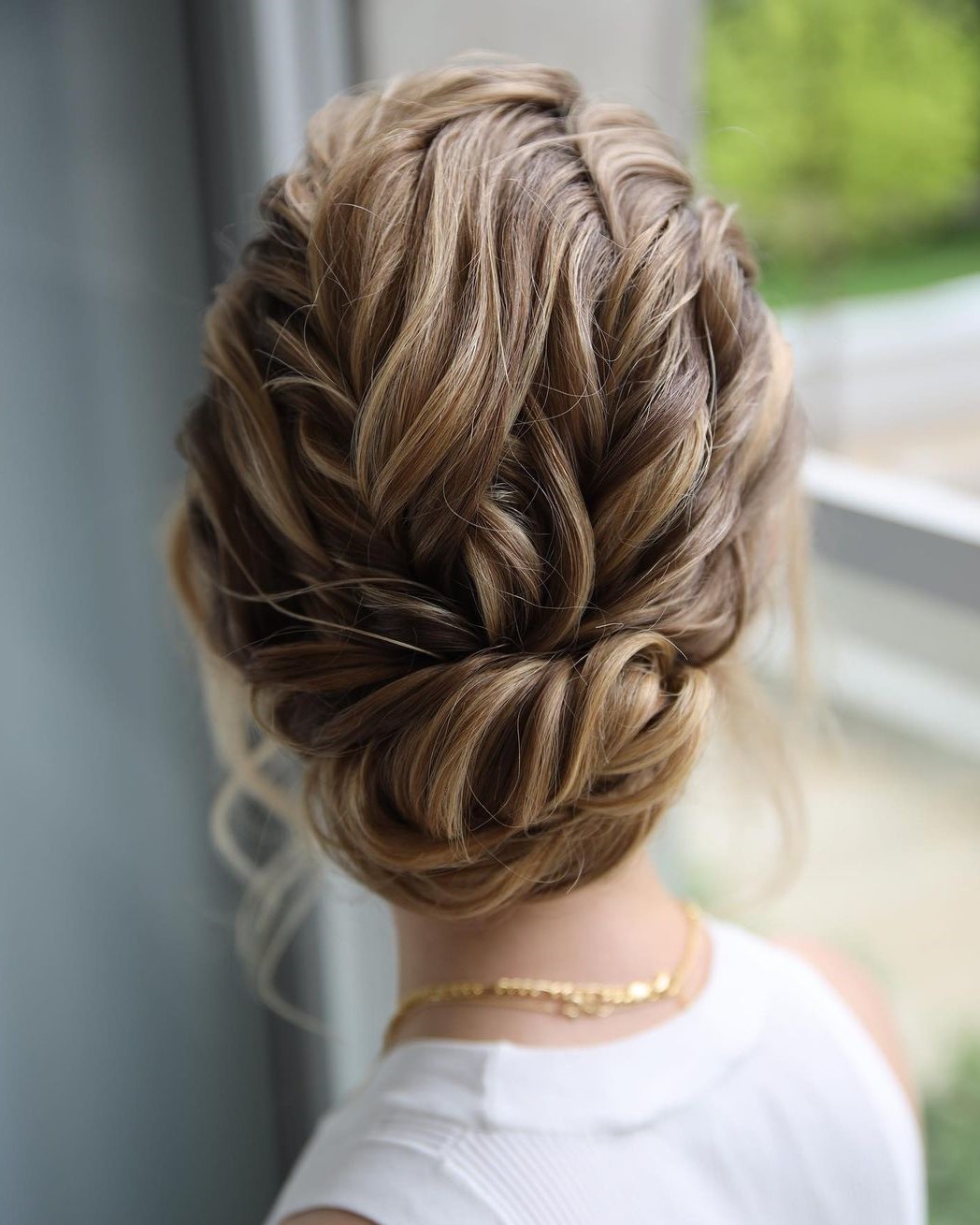 Cute Twisted Bun with Loose Braids