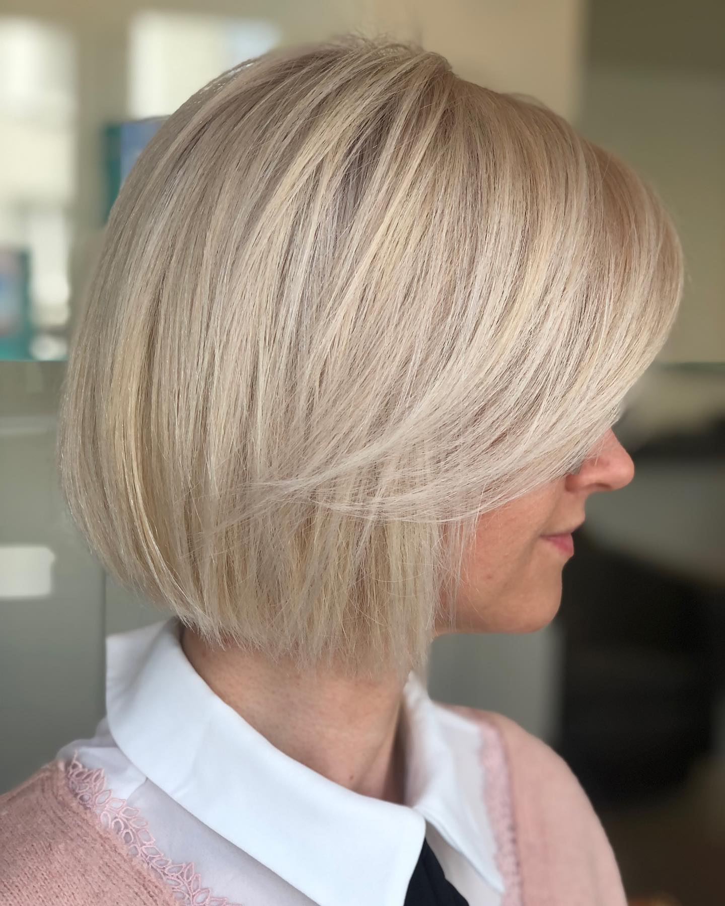 Wispy Ash Blonde Bob with Swoopy Bangs